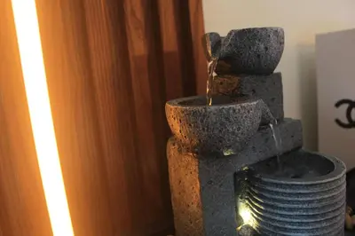 a water fountain with a bucket of water at EL MEIR PRIME CABIN w/ Bathtub near EK in Santa Rosa