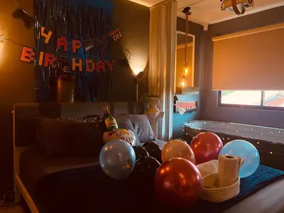 a room with balloons and a bed with a tub at EL MEIR PRIME CABIN w/ Bathtub near EK in Santa Rosa
