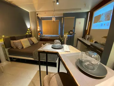 a room with a bed and a table with dishes on it at EL MEIR PRIME CABIN w/ Bathtub near EK in Santa Rosa