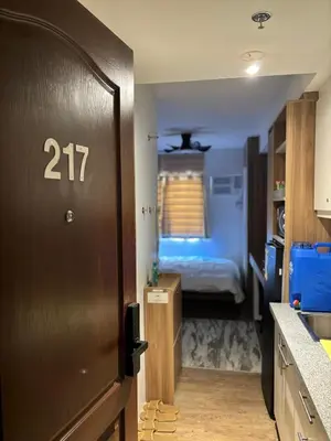 a room with a door with a bedroom in it at Casa Del Hasmin in Puting Kahoy