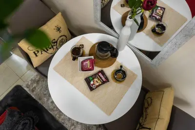 a white table with some food and glasses on it at Luxury Resort Condo in Pasig FastWifiPoolSmartLock in Manila