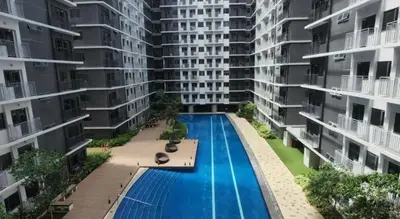 an aerial view of an apartment complex with a swimming pool at One bedroom with Balcony-M&M City Comfort in Manila