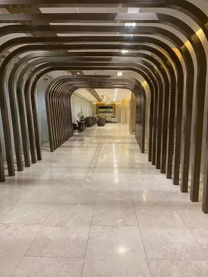 a hallway of a building with a long hallwayngth at One bedroom with Balcony-M&M City Comfort in Manila