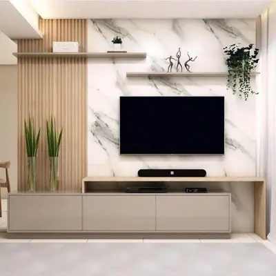 a living room with a flat screen tv on a wall at MOA Shore 3 tower 2 in Manila