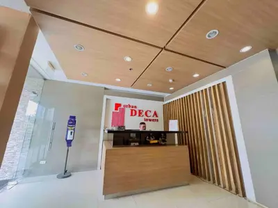 a lobby with a desk and a sign in a building at Urban Deca EDSA Budget Place w/ Unli Wi-Fi Netflix in Manila