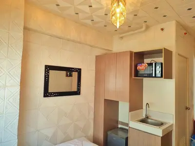 a bathroom with a mirror and a sink at Urban Deca EDSA Budget Place w/ Unli Wi-Fi Netflix in Manila