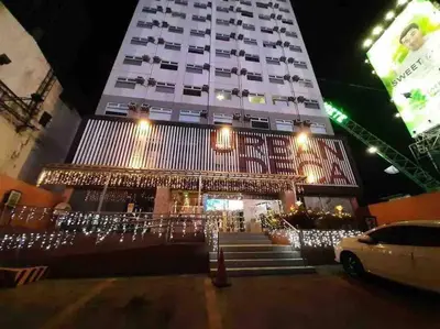 a building with christmas lights in front of it at Urban Deca EDSA Staycation w/Unli Wi-Fi & Netflix in Manila