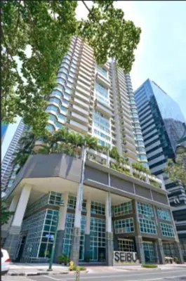 a tall building with trees on top of it at BGC Beautiful Large 1 Bedroom Condo Sleeps 3 Adults in Manila