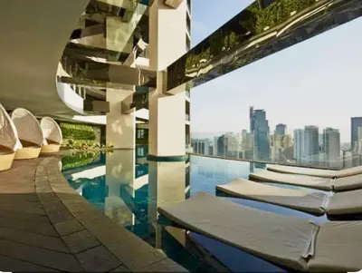 a swimming pool with a view of a city at Kaiyana Apartments in Manila