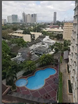 arial view of a building with a swimming pool at Ilustrata Residences Condominium in Manila