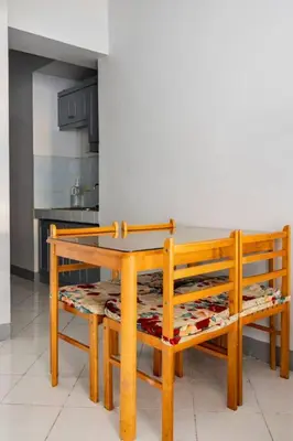 a wooden table and chairs in a kitchen at Pacific Regency, Manila studio type with balcony in Manila