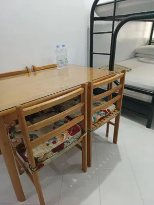 a wooden table with a shelf with wine bottles at Pacific Regency, Manila studio type with balcony in Manila