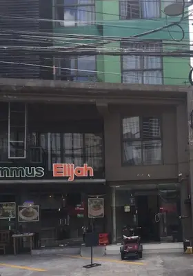 a building with an emium sign on the side of it at Spacious Studio Apartment B306 in Manila