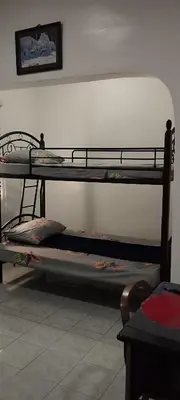 two bunk beds in a room next to a wall at 11 Guest - Unit 3 in Santa Rosa