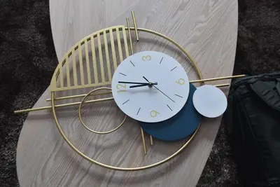 a clock sitting on top of a wooden bench at House KubU at Lush Residences Makati in Manila
