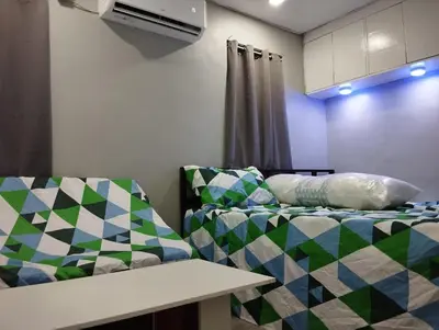a living room with a couch and a bed at 25 Guest - Unit 1,2&3 - 2 units Bungalow and Studio type in Santa Rosa