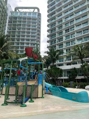 a playground on the beach with a slide at The Solaris Point with Pool View in Manila