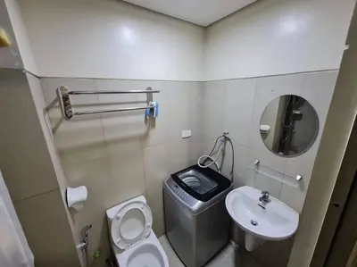 a small bathroom with a toilet and a sink at Condo with Bayview in Manila (along Roxas Boulevard) in Manila