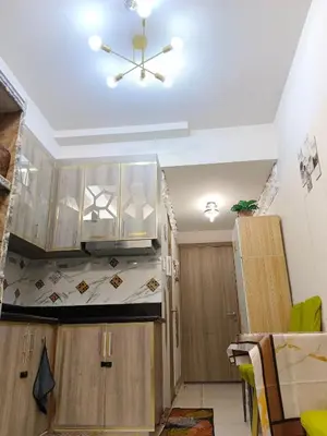 a kitchen with wooden cabinets and a ceiling at Caine's Cabin 27th Feel our Love and Warmth Welcome in Manila