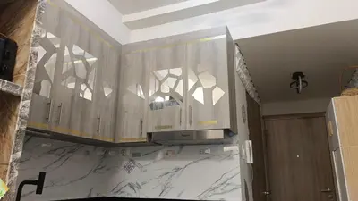 a kitchen with wooden cabinets and a counter top at Caine's Cabin 27th Feel our Love and Warmth Welcome in Manila