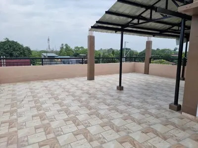 a patio with awning on top of a building at C Mary's Staycation in Tanza Cavite Condo Type with balcony good for 2 person in Tanza