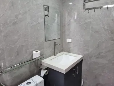 a bathroom with a sink and a toilet and a mirror at C Mary's Staycation in Tanza Cavite Condo Type with balcony good for 2 person in Tanza