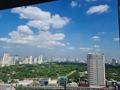 a view of a city with buildings and trees at ADB AVENUE TOWER in Manila