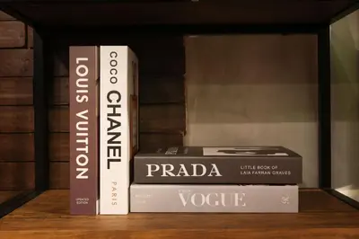 three books sitting on top of a shelf at Kensal Industrial - Air Residences in Manila