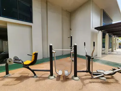 a group of exercise equipment in front of a building at 37 BGC Prime Suite across Uptown Mall & Mitsukoshi Mall FREE Parking in Manila
