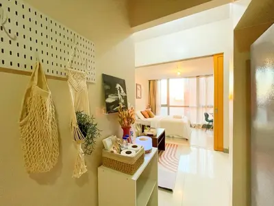 a room with a living room with a couch and a living room at Best BGC Condo Near Uptown Area #oursw30b2 in Manila