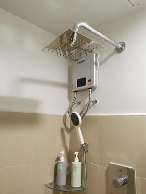 a shower in the corner of a bathroom at Shore 3 mall of Asia condotel in Manila