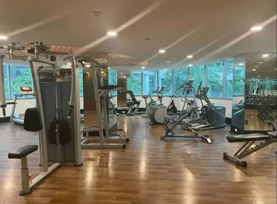 a gym with a bunch of exercise bikes in a room at Gora studio in Avant BGC parking with fee in Manila