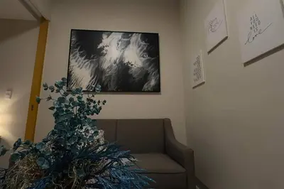 a living room with a christmas tree and a couch at #31 One Uptown Residences BGC in Manila