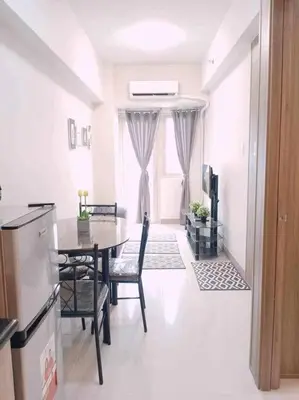 a kitchen and dining room with a table and chairs at #44 Coast Residences Tower1-20th in Manila