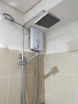 a shower in a bathroom with a shower head at #44 Coast Residences Tower1-20th in Manila