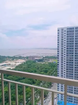 a view from a balcony of a tall building at #44 Coast Residences Tower1-20th in Manila