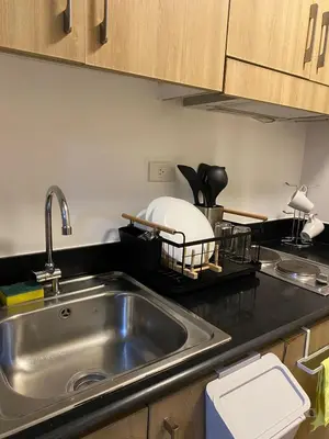 a kitchen with a sink and a counter top at D' Shore Line - Shore Residences MOA PASAY in Manila