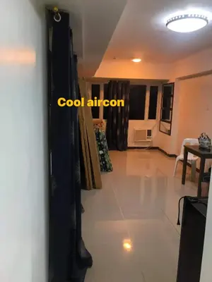 a view of a living room with a ceiling at Solemare Parksuites Condominium in Manila