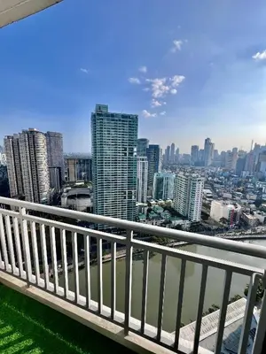 a view of the city from the balcony of a building at Acqua Private Residences - Livingstone Tower (Makati - Mandaluyong) in Manila