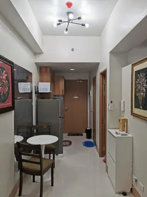 a kitchen and dining room with a table and chairs at Mall of Asia shore 3 tower 2 condotel in Manila