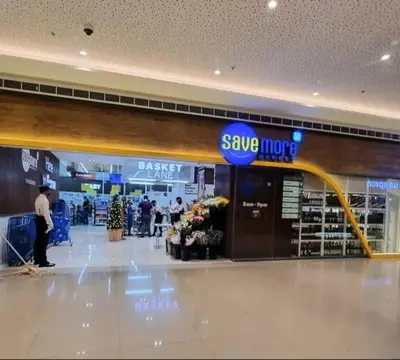 a store with a large sign in a shopping mall at Sun and Moon D'wood air residences makati in Manila