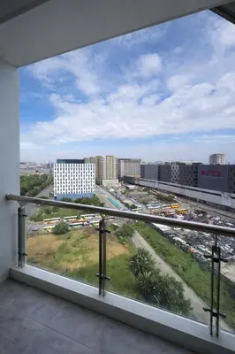 a balcony with a view of a parking lot at Studio with Balcony Near Okada Manila and MOA LCONDOTEL in Manila