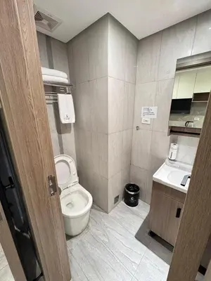 a bathroom with a toilet and a sink at Studio with Balcony Near Okada Manila and MOA LCONDOTEL in Manila