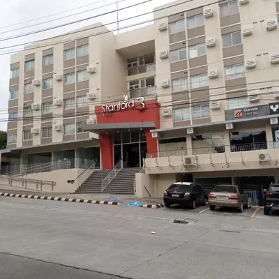 a building with a parking lot in front of it at Stanford Suites 3, staycation near Nuvali, located in Silang in Bayabasan
