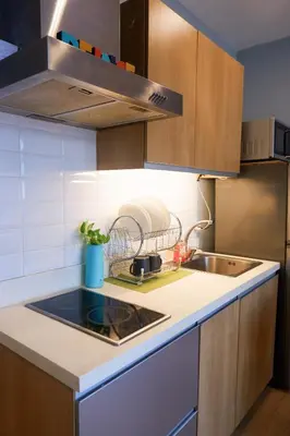 a kitchen with a sink and a counter top at Condo in Makati with Fast WiFi, Free Pool, Netflix and Own Balcony in Manila