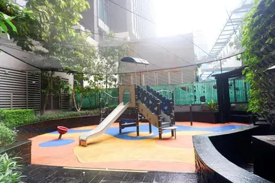 a playground in a building with a slide at Condo in Makati with Fast WiFi, Free Pool, Netflix and Own Balcony in Manila