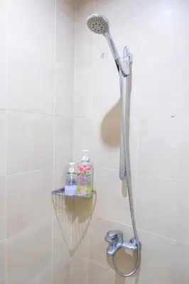 a shower with a shower head in a bathroom at Condo in Makati with Fast WiFi, Free Pool, Netflix and Own Balcony in Manila