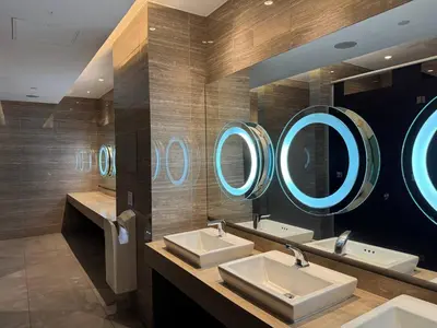 a bathroom with three sinks and three mirrors at Condo in Makati with Fast WiFi, Free Pool, Netflix and Own Balcony in Manila