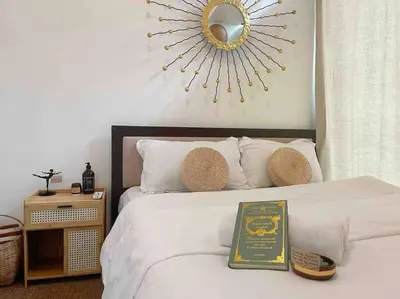 a bedroom with a bed with a plaque on it at Solana in Avant BGC parking with fee in Manila