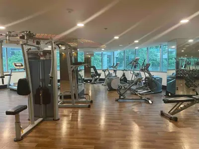 a gym with a bunch of treadmills and machines at Solana in Avant BGC parking with fee in Manila